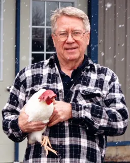 Bob Bailey training a chicken outdoors in the snow