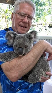 Bob Bailey holding a koala in Australia